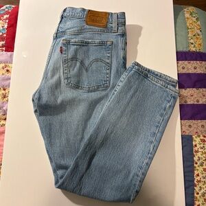 Levi's Women's Light washed Blue Jeans. Sz 27, Inseam 26.5 and button fly.